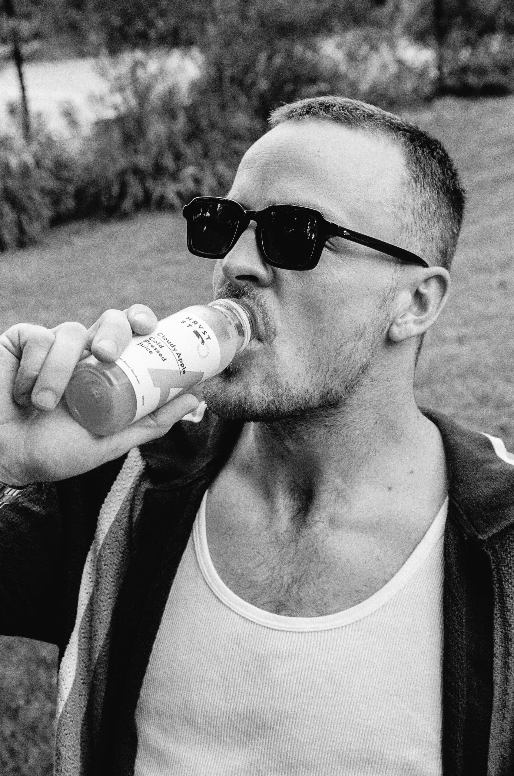 Australian man drinking Hrvst St juice looking cool